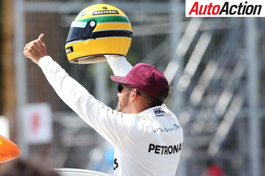 Lewis Hamilton presented with Ayrton Senna helmet - Photo: LAT