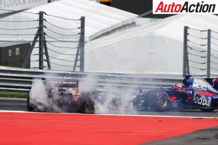 Daniil Kvyat spins Fernando Alonso at the first corner - Photo: LAT