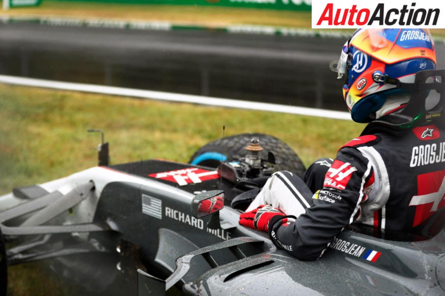 Romain Grosjean climbs out of his crashed Haas - Photo: LAT