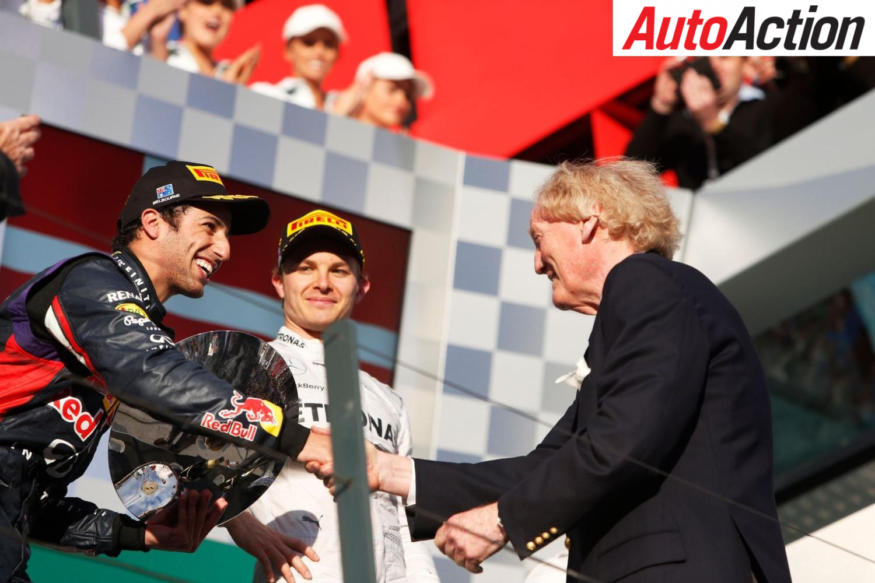 Ron Walker presenting Daniel Ricciardo with a trophy on the Melbourne Grand Prix podium - Photo: LAT