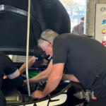 Ken McNamara works on Brodie Kostecki's engine during Practice 1 in Darwin.
