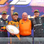 Max Verstappen, Lando Norris, Rob Marshall and George Russell on the podium of the 2025 Australian Grand Prix