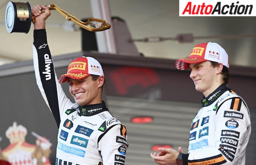 Winner Lando Norris, McLaren, and third-place finisher Oscar Piastri, McLaren, on the podium after the 2025 F1 Monaco Grand Prix.