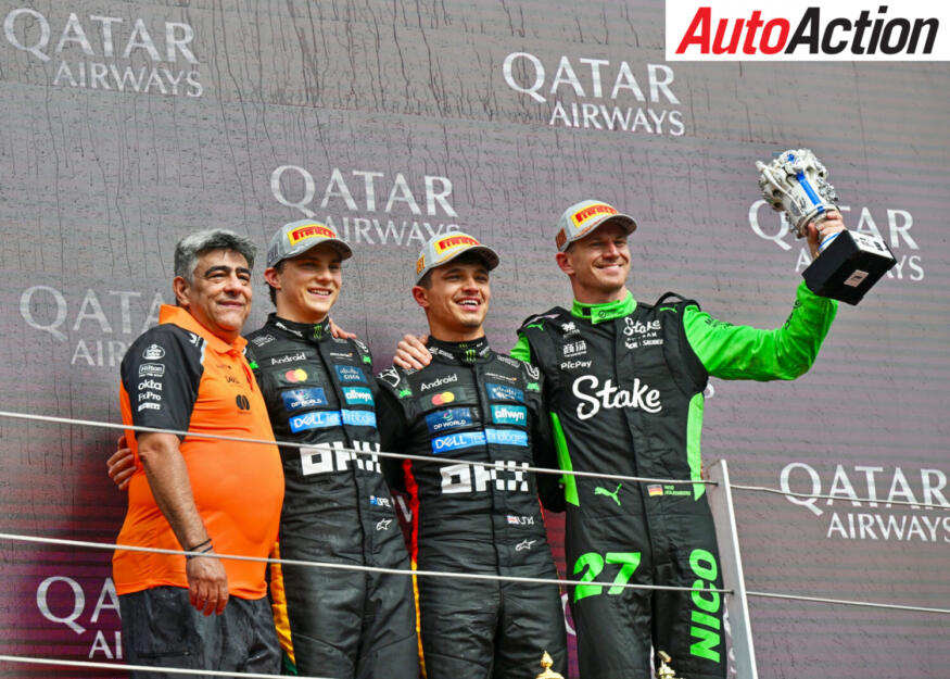 Lando Norris and Oscar Piastri, McLaren, with Nico Hulkenberg, Stake F1 Team KICK Sauber, on the podium at the 2025 F1 British Grand Prix.