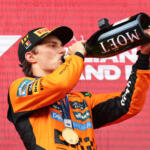 Oscar Piastri, McLaren, celebrates on the podium after winning the 2025 F1 Belgian Grand Prix.