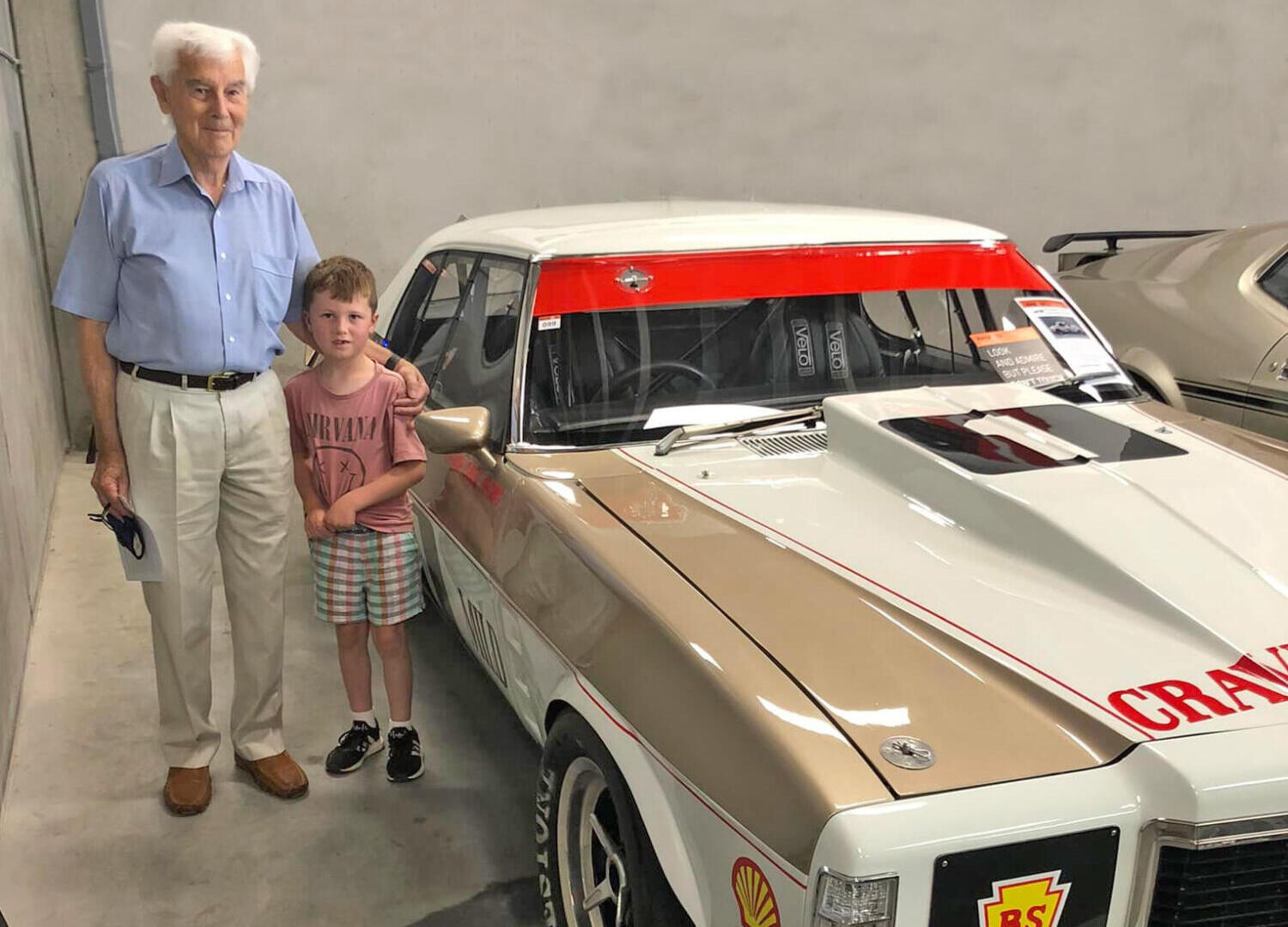 John Sheppard with Great Grandson and the restored HJ Monaro he built