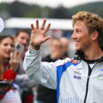 Liam Lawson, Visa Cash App Racing Bulls, waves at fans during previews ahead of the 2025 F1 Belgian Grand Prix.