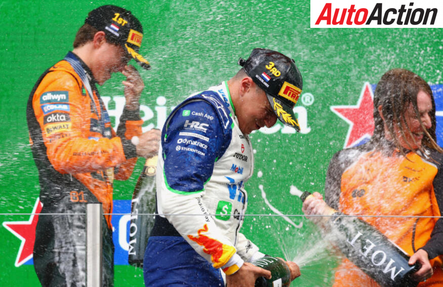 Race winner Oscar Piastri, McLaren and Third placed Isack Hadjar, Visa Cash App Racing Bulls, celebrate on the podium after the 2025 F1 Dutch Grand Prix.