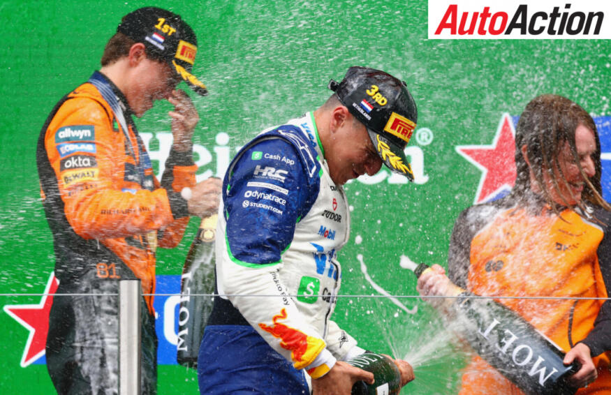 Race winner Oscar Piastri, McLaren and Third placed Isack Hadjar, Visa Cash App Racing Bulls, celebrate on the podium after the 2025 F1 Dutch Grand Prix.