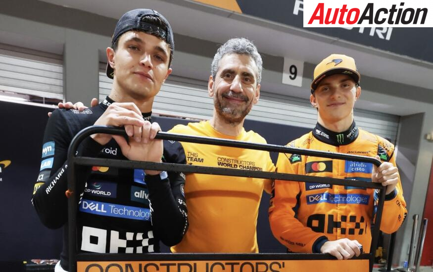 Lando Norris, Andrea Stella and Oscar Piastri, McLaren, celebrate constructors' championship victory after the 2025 F1 Singapore Grand Prix.