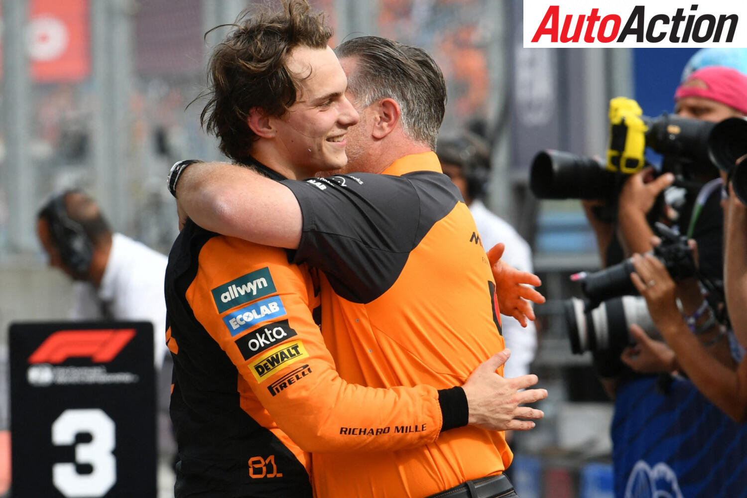 Oscar Piastri and Zak Brown embrace